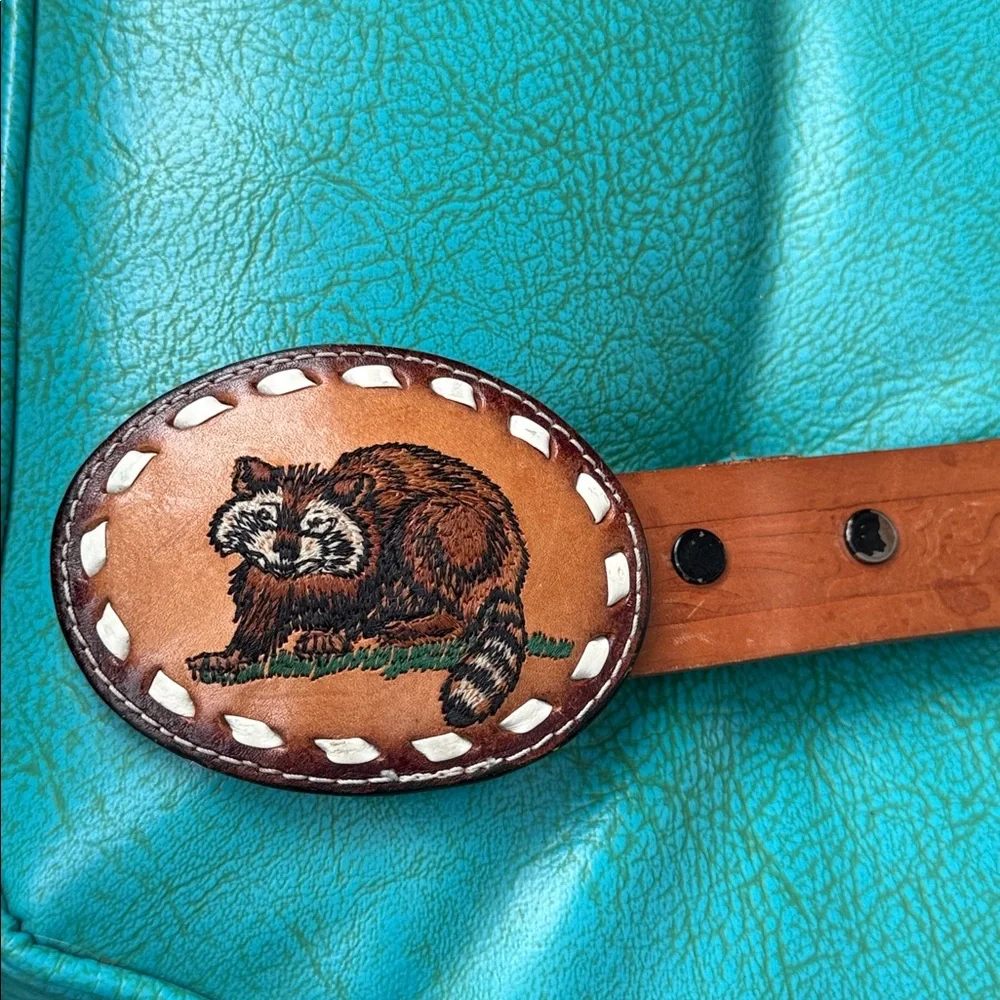 Tan tooled leather belt whipstitching statement embroidered raccoon buckle 34